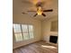 Cozy living room with fireplace and large windows offering ample natural light and stylish vinyl flooring at 1941 Olsen Ln, Charlotte, NC 28213