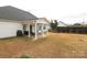 Spacious backyard featuring a patio, outdoor grill, white vinyl fence, and mature greenery at 2003 Hemby Commons Pkwy, Indian Trail, NC 28079