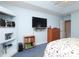 Bedroom featuring a dresser, shelving, and wall-mounted television at 2003 Hemby Commons Pkwy, Indian Trail, NC 28079