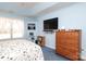 Light-blue bedroom featuring a dresser and a wall-mounted TV at 2003 Hemby Commons Pkwy, Indian Trail, NC 28079