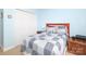 Bedroom with blue accent wall, double door closet, and simple nightstand at 2003 Hemby Commons Pkwy, Indian Trail, NC 28079