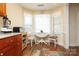 Bright breakfast nook with a cozy round table, lots of windows, and bright natural light for Gathering at 2003 Hemby Commons Pkwy, Indian Trail, NC 28079