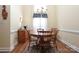 Inviting dining area featuring a round wooden table set, chandelier, and lots of natural light from the big window at 2003 Hemby Commons Pkwy, Indian Trail, NC 28079