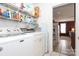 Laundry room with neutral tile and shelving for storage at 2003 Hemby Commons Pkwy, Indian Trail, NC 28079