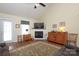 Charming living room with a vaulted ceiling, fireplace, and rustic furniture, creating a cozy and inviting atmosphere at 2003 Hemby Commons Pkwy, Indian Trail, NC 28079