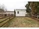 Outdoor shed with double doors, and a fenced backyard with mature trees at 2003 Hemby Commons Pkwy, Indian Trail, NC 28079