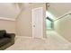 Finished attic with a ceiling fan, and a door leading to an adjacent room at 2025 Sojourn Rd, Marshville, NC 28103