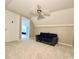Attic space featuring neutral walls, a ceiling fan, and a leather sofa at 2025 Sojourn Rd, Marshville, NC 28103