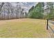 Sprawling backyard with mature trees, providing privacy and a tranquil setting at 2025 Sojourn Rd, Marshville, NC 28103