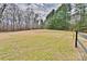 Expansive backyard featuring a mix of grassy areas and mature trees offering privacy and room to roam at 2025 Sojourn Rd, Marshville, NC 28103