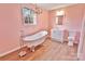 Charming bathroom featuring a claw foot tub, modern vanity, window, and chandelier at 2025 Sojourn Rd, Marshville, NC 28103