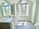 Bright bathroom featuring sink vanity with marble countertops and lots of natural light at 2025 Sojourn Rd, Marshville, NC 28103