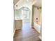 Well-lit bathroom featuring a large window, stylish vanity, and a tub with a shower at 2025 Sojourn Rd, Marshville, NC 28103