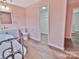 Pink bathroom with white trim, vintage fixtures, and modern vanity at 2025 Sojourn Rd, Marshville, NC 28103