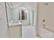 A bright bathroom with a tub, vanity, and window at 2025 Sojourn Rd, Marshville, NC 28103