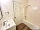 Compact bathroom showcasing a modern sink, toilet, and a shower/tub combo with updated fixtures at 2025 Sojourn Rd, Marshville, NC 28103