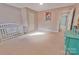 A bedroom featuring pale pink walls, neutral carpet, and ample natural light from the doorway at 2025 Sojourn Rd, Marshville, NC 28103