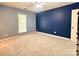 Spacious bedroom with carpeted floors, two toned paint, ceiling fan, and one window with natural light at 2025 Sojourn Rd, Marshville, NC 28103