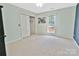 Light and airy bedroom with a window view and a closet with white folding doors at 2025 Sojourn Rd, Marshville, NC 28103