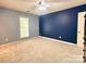 A bedroom painted with blue accent walls with a ceiling fan at 2025 Sojourn Rd, Marshville, NC 28103