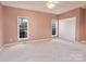 Neutral bedroom featuring wall-to-wall carpet, and two windows that provide an abundance of natural light at 2025 Sojourn Rd, Marshville, NC 28103