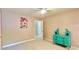 Neutral bedroom with a princess poster and bright blue dresser at 2025 Sojourn Rd, Marshville, NC 28103