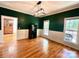 Dining room with hardwood floors, wainscoting and natural light, ideal for gatherings and entertaining at 2025 Sojourn Rd, Marshville, NC 28103