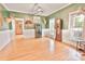 Spacious dining room featuring beautiful hardwood floors, white wainscoting, and unique décor at 2025 Sojourn Rd, Marshville, NC 28103