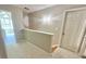 Hallway featuring carpeted floors, access door to room, half wall partition, and natural light at 2025 Sojourn Rd, Marshville, NC 28103