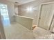 Upstairs hallway offers access to additional rooms, creating a functional and connected living space at 2025 Sojourn Rd, Marshville, NC 28103