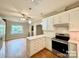 Well-lit kitchen with white cabinets, quartz countertops, and modern appliances creates a modern and functional workspace at 2025 Sojourn Rd, Marshville, NC 28103
