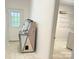 Mud room with an exterior door, unique jukebox and access to the laundry room at 2025 Sojourn Rd, Marshville, NC 28103