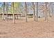 Outbuilding with a covered area on wooded lot at 2025 Sojourn Rd, Marshville, NC 28103