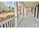 Inviting covered porch with white columns, providing a perfect spot for relaxation at 2025 Sojourn Rd, Marshville, NC 28103