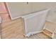 Stairwell showcasing the railing, neutral paint and updated flooring at 2025 Sojourn Rd, Marshville, NC 28103