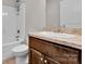 Bathroom featuring brown vanity, white sink and toilet, and tile flooring at 2211 Waverly St, Albemarle, NC 28001