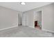 Bright bedroom with neutral carpet, closet, and ensuite bathroom with granite vanity at 2211 Waverly St, Albemarle, NC 28001