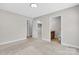 Neutral bedroom offering a view into the closet and primary ensuite bathroom at 2211 Waverly St, Albemarle, NC 28001