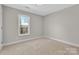 Cozy bedroom with natural light and neutral carpet at 2211 Waverly St, Albemarle, NC 28001