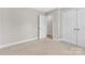 Bright bedroom with neutral carpet and ensuite bathroom access and closet at 2211 Waverly St, Albemarle, NC 28001