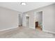 Bright bedroom with neutral carpet, closet, and ensuite bathroom with granite vanity at 2211 Waverly St, Albemarle, NC 28001