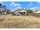 Charming home featuring a quaint front porch, gray siding, and a detached garage at 2211 Waverly St, Albemarle, NC 28001