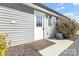 Charming home featuring a front door with decorative window and tidy landscaping at 2211 Waverly St, Albemarle, NC 28001