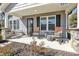 Charming front porch with rocking chairs and swing, perfect for relaxing outdoors at 2211 Waverly St, Albemarle, NC 28001