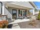 Inviting covered front porch with rocking chairs and stone-wrapped columns at 2211 Waverly St, Albemarle, NC 28001