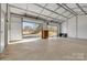 A spacious garage interior with roll up doors, and plenty of room for storage and projects at 2211 Waverly St, Albemarle, NC 28001