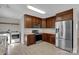 Modern kitchen featuring stainless steel appliances, wooden cabinets, and light wood floor at 2211 Waverly St, Albemarle, NC 28001