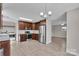 Spacious kitchen featuring stainless steel appliances, wooden cabinets, and wood-look flooring at 2211 Waverly St, Albemarle, NC 28001