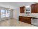 Corner kitchen with wood cabinets, marble countertops, and wood-look flooring at 2211 Waverly St, Albemarle, NC 28001