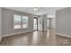 Open living area featuring laminate flooring, neutral paint, and a welcoming entrance at 2211 Waverly St, Albemarle, NC 28001